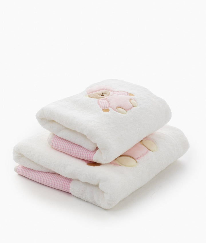 Plush white terry cloth baby bath towels with pink embroidered bear