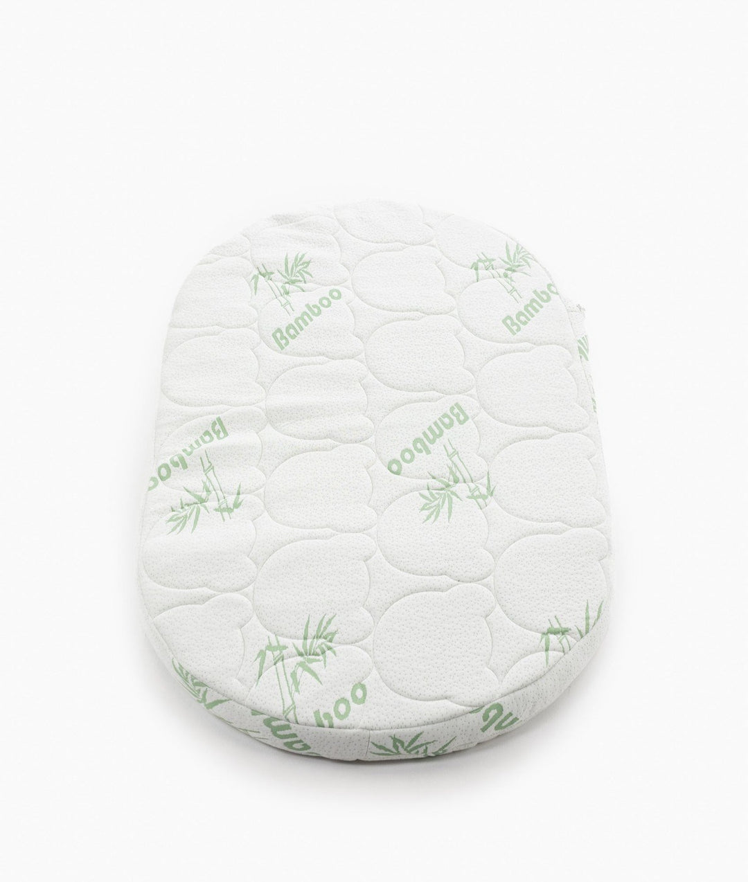 White baby cot with teddy bear design styled in a neutral nursery room