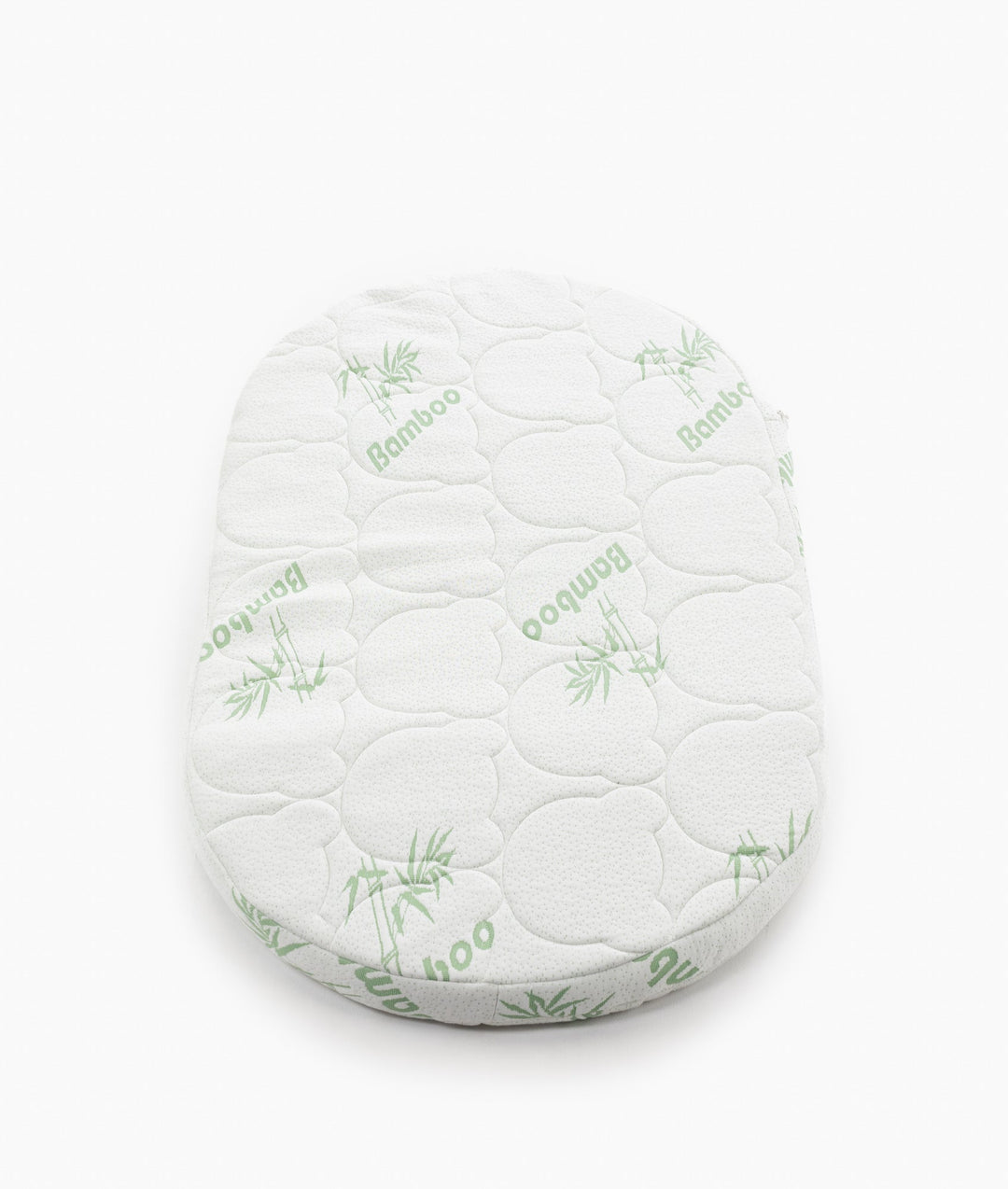 White baby cot with teddy bear design styled in a neutral nursery room