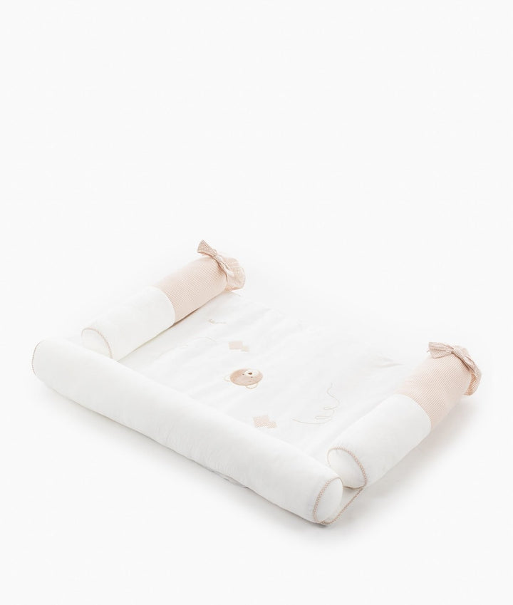 High-angle view of 4-piece changing station with rectangular base and side rails