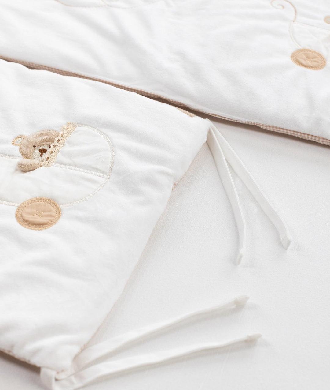 White and beige cot bumper set for baby cot