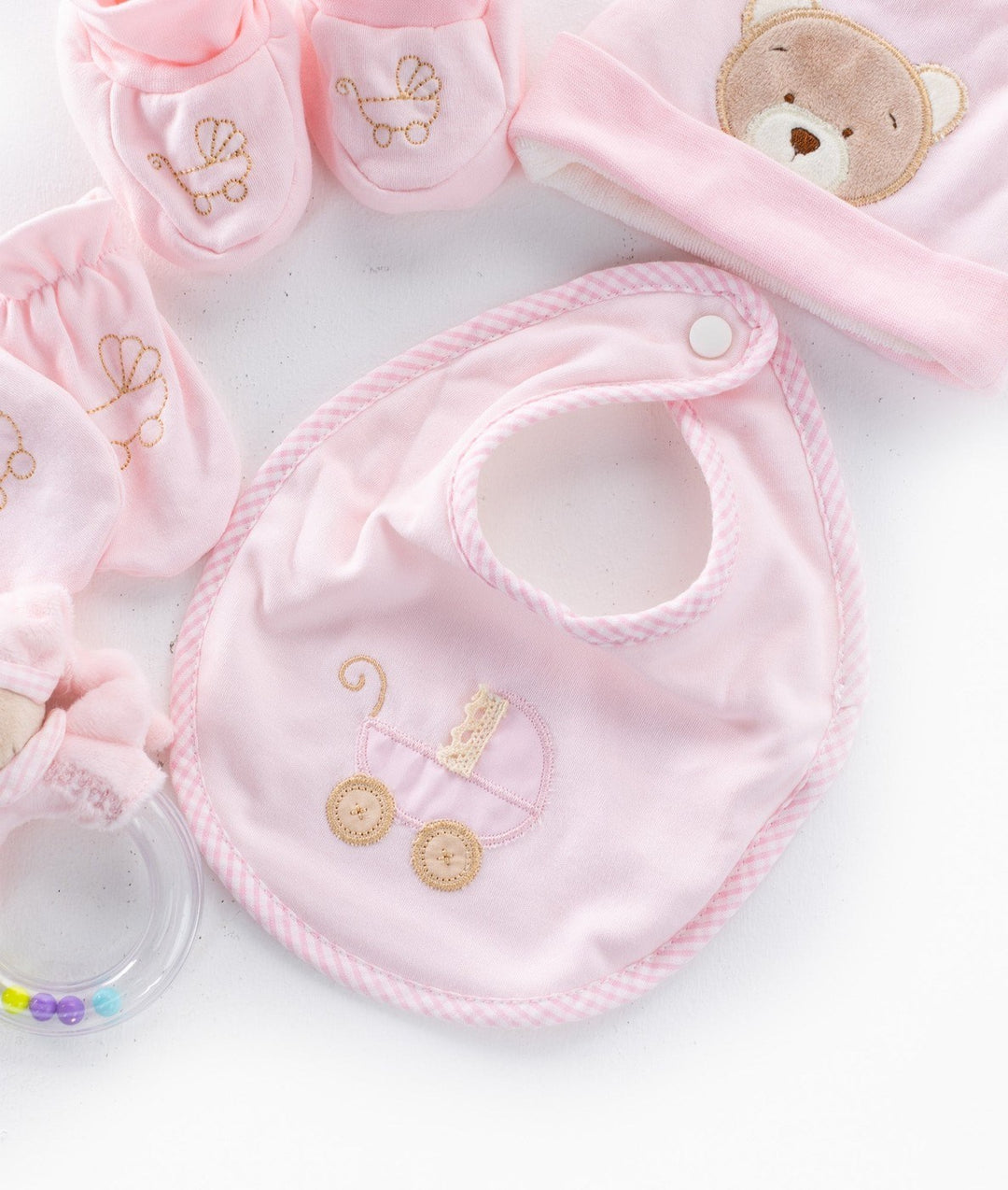 Pink gingham bib with pram embroidery and sensory rattle