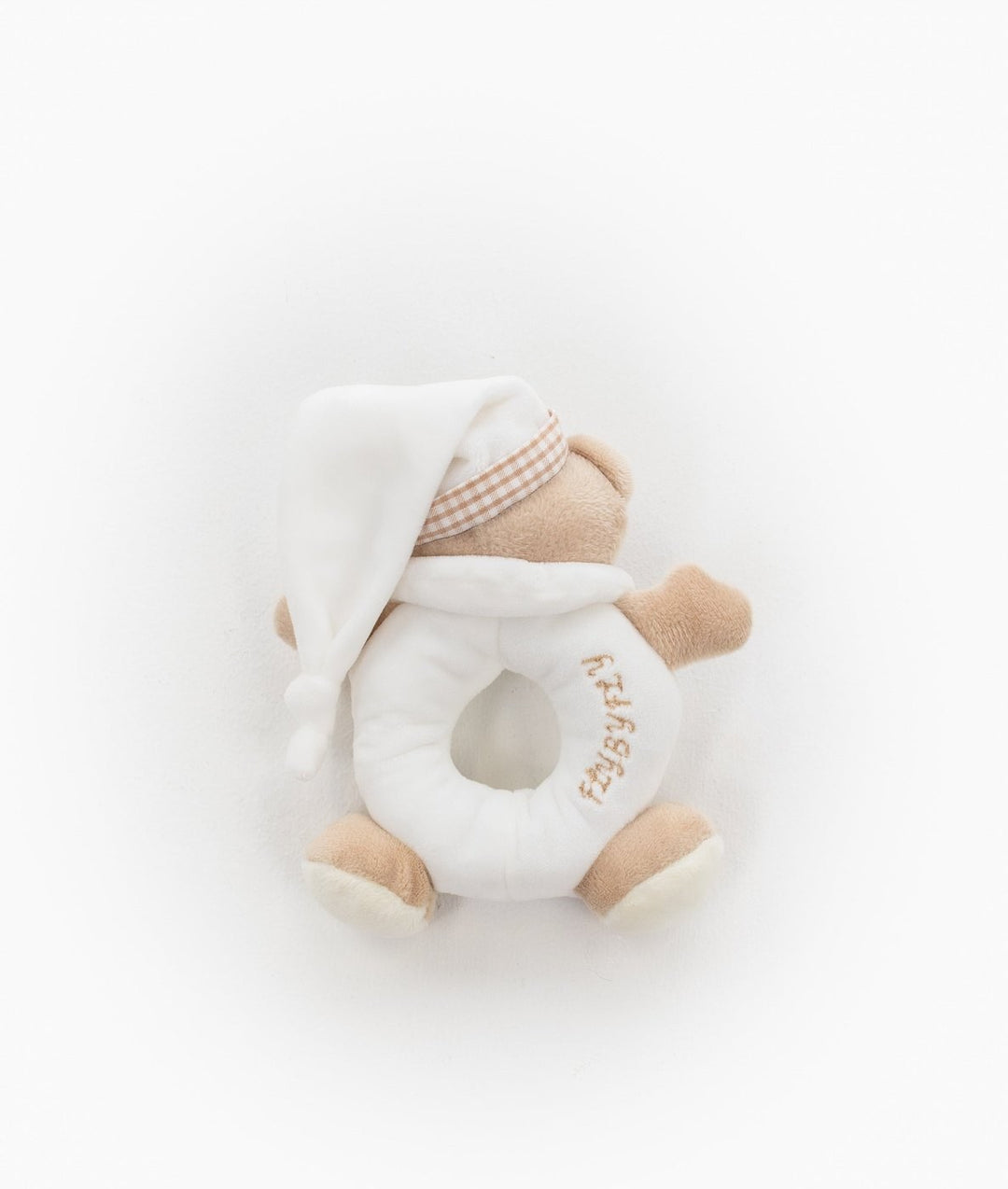 Close up of beige bear rattle with white nightcap and gold text ring