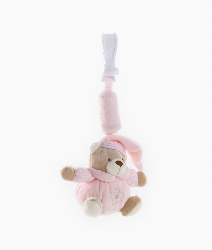 Soft texture of pink plush bear toy hanging from secure clip