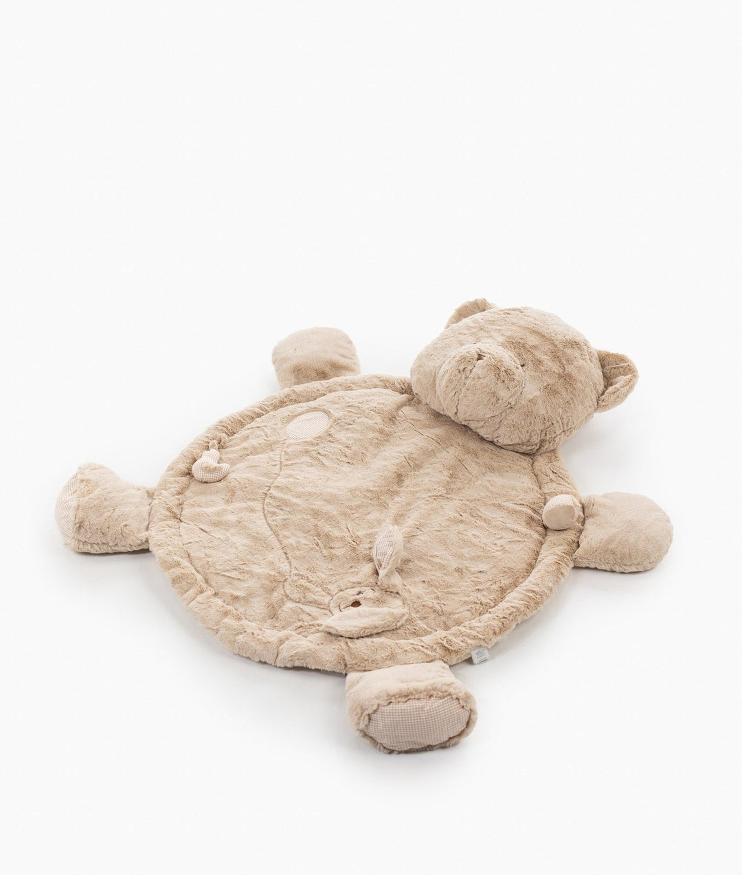 Flat lay of beige teddy bear playmat showing plush texture, rounded ears, limbs, and gingham paw pads