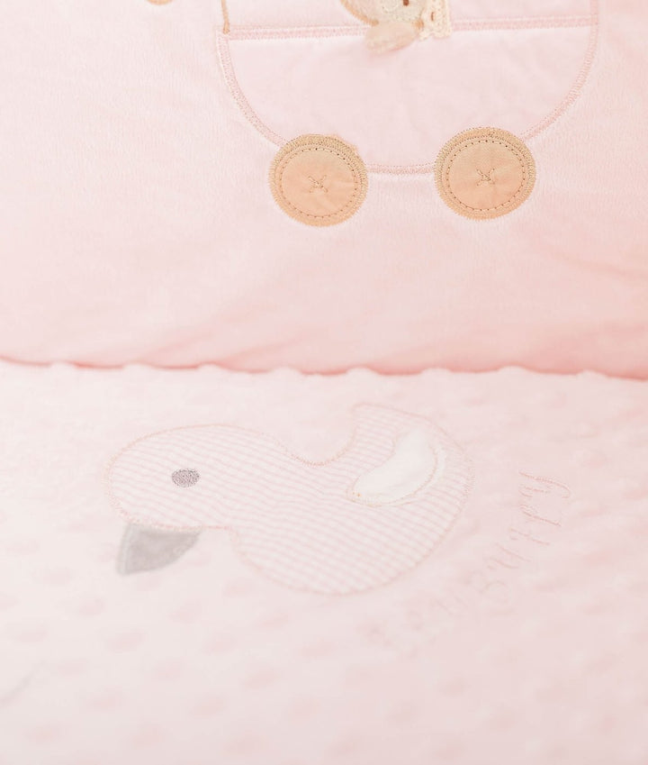 Pink dotted quilt detail showing gingham duck applique and beige button accents