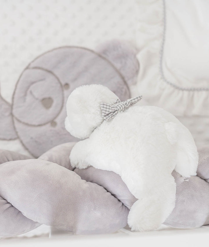 grey gingham bow tie on white plush teddy bear with grey braided crib bumper