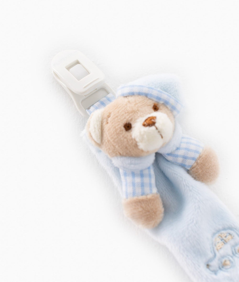 Light blue plush dummy clip with teddy bear wearing gingham hat and white plastic clip