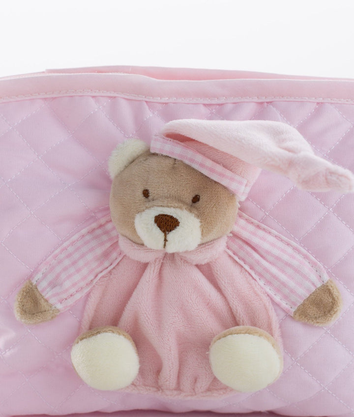 Close up of plush teddy bear embellishment on diamond stitch bag