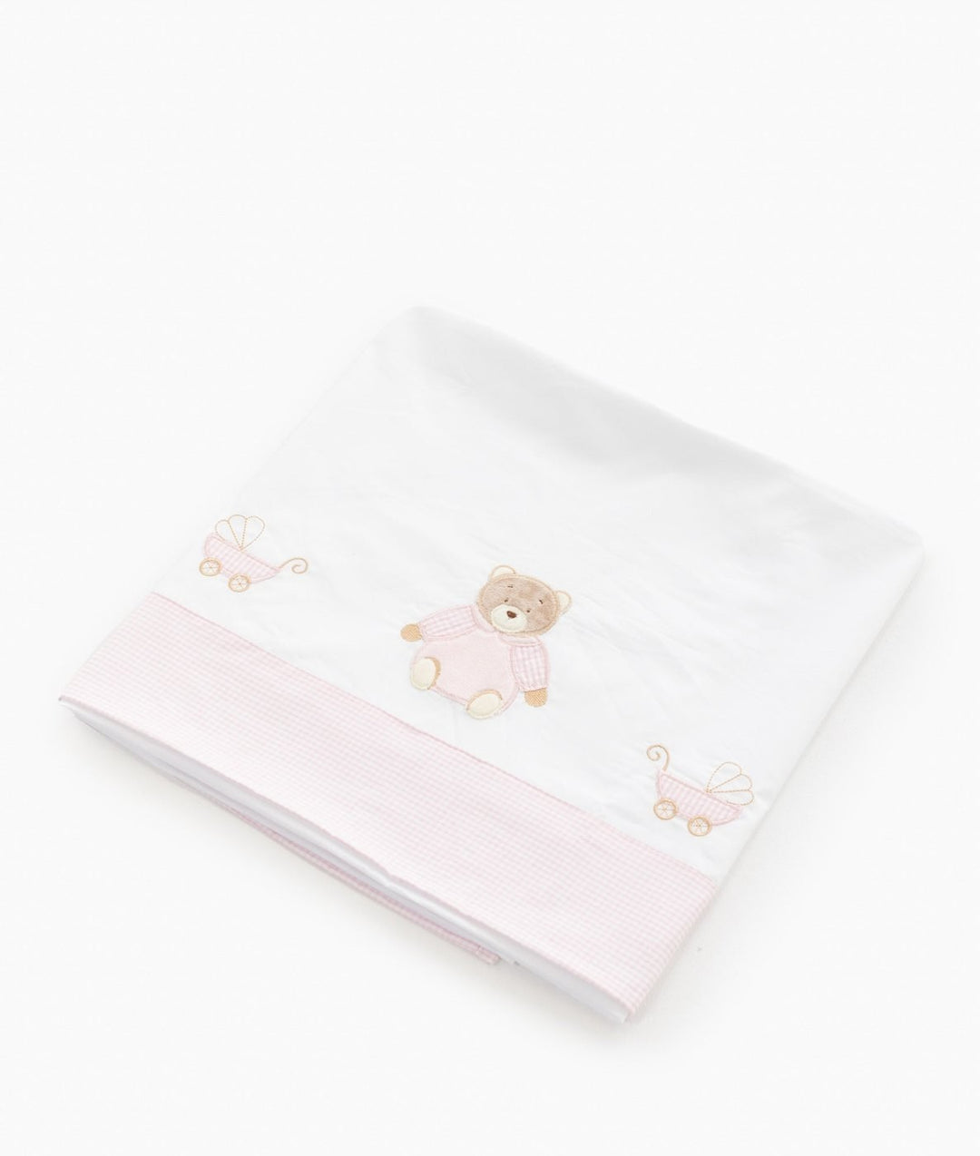 Folded white baby flat sheet with pink gingham band