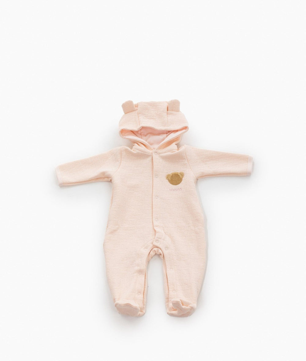 Soft pink footed baby one-piece with attached hood and brown bear motif