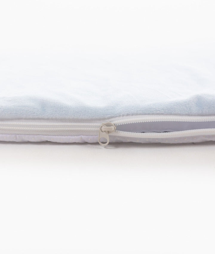 Side profile of blue plush playmat showing padding thickness and zipper pull tab detail