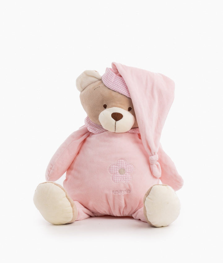 Three-quarter view of seated pink plush bear with floral belly design