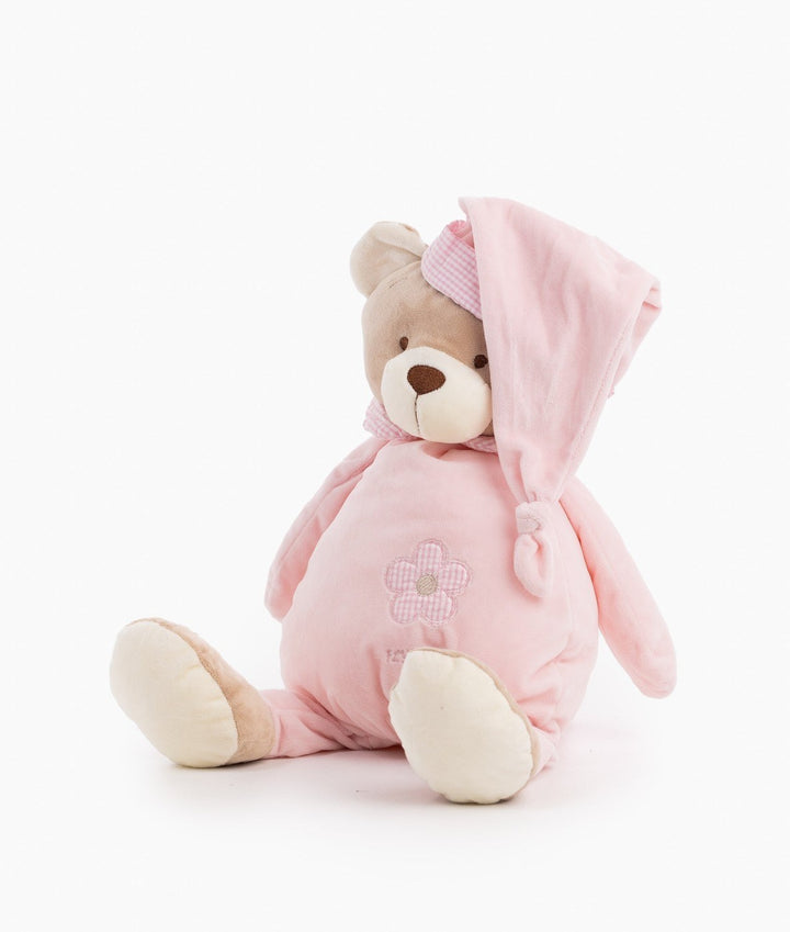Front angle of pink stuffed bear highlighting cream paw pads and soft texture
