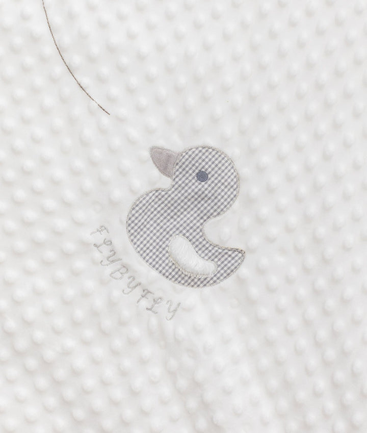 Grey gingham duck appliqué detail on white bubble quilt texture