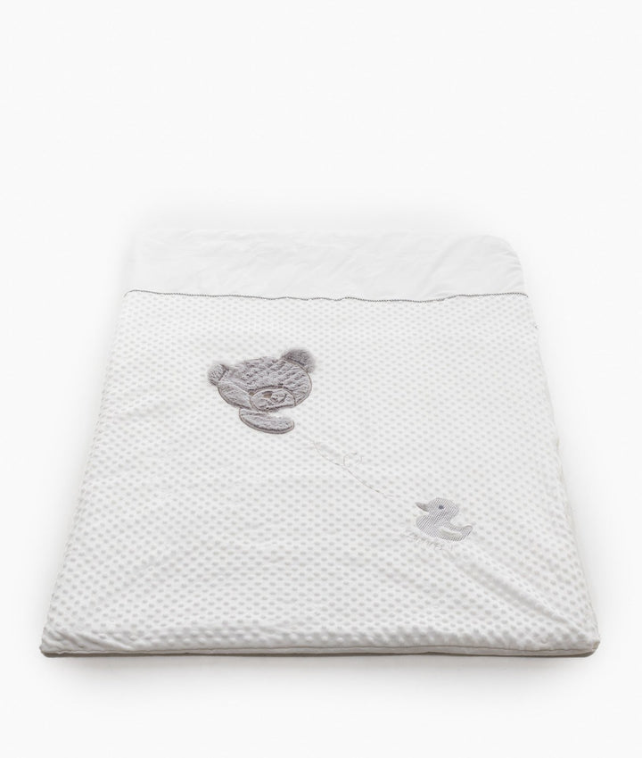White dotted bubble quilt cover with grey piped trim and appliqué