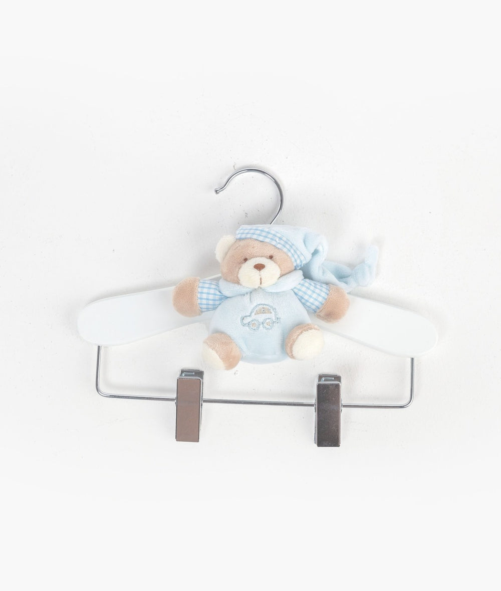 Front flat lay of white wooden baby hanger with silver clips and blue teddy bear