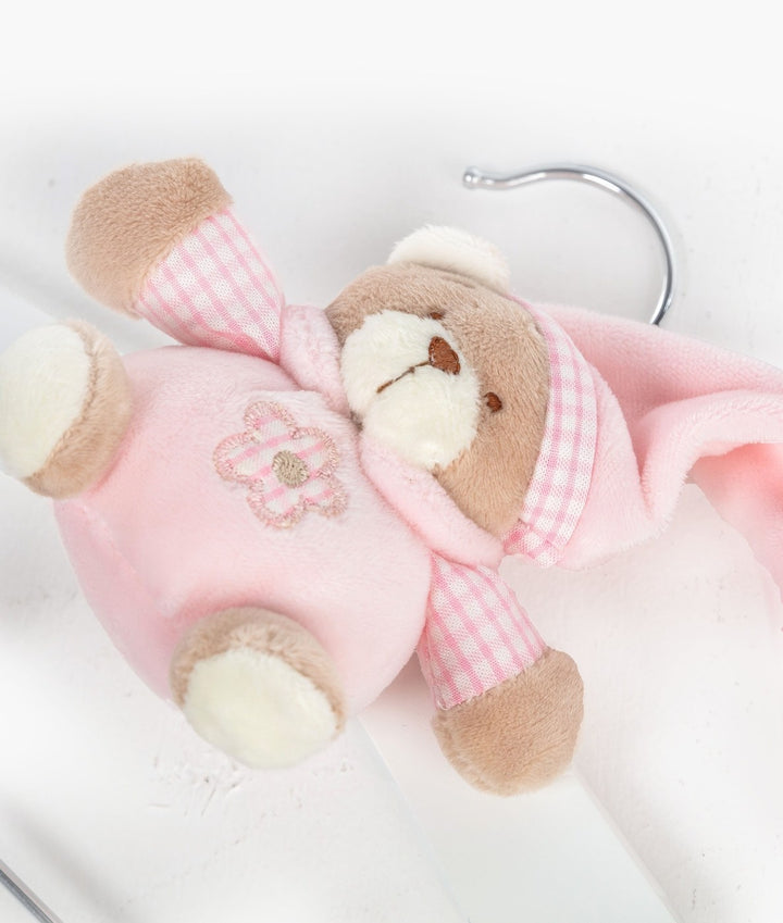 Pink wooden hanger with clips