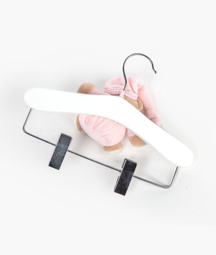Pink wooden hanger with clips