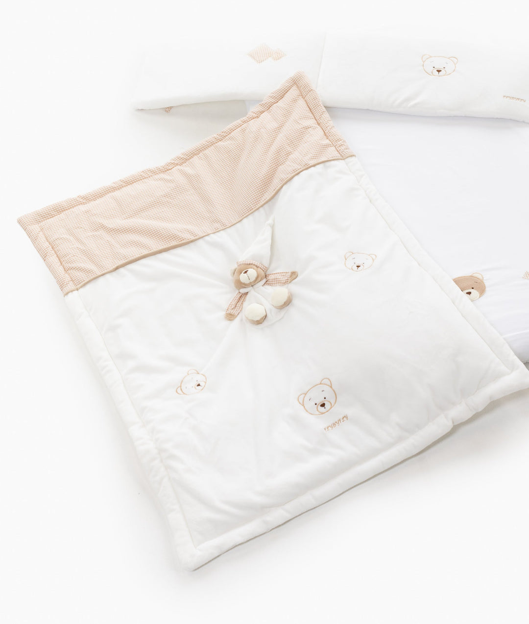 White and beige baby bassinet bedding