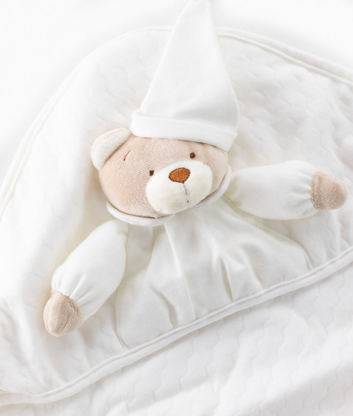 White and beige newborn swaddle blanket