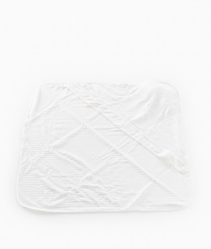 White and beige newborn swaddle blanket